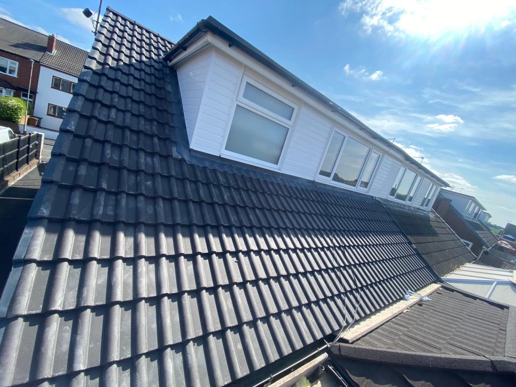 Completed grey tile roof with new dormer